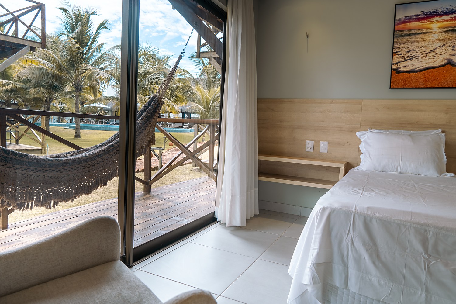 Varanda com rede e vista para os coqueiros — Villas BobZ